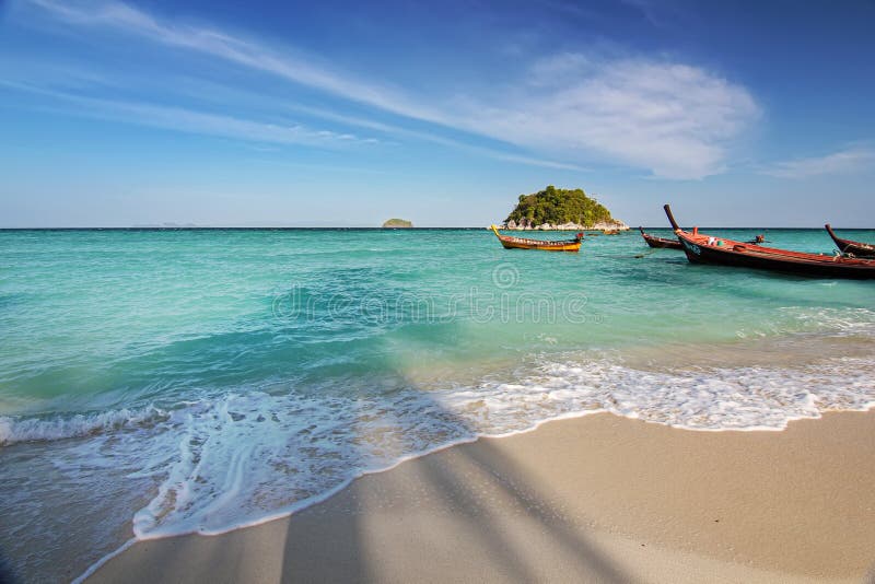 Beautiful Thailand travel island `Koh Lipe` white sand beach and turquoise sea water with peace clear blue sky landscape backgroun