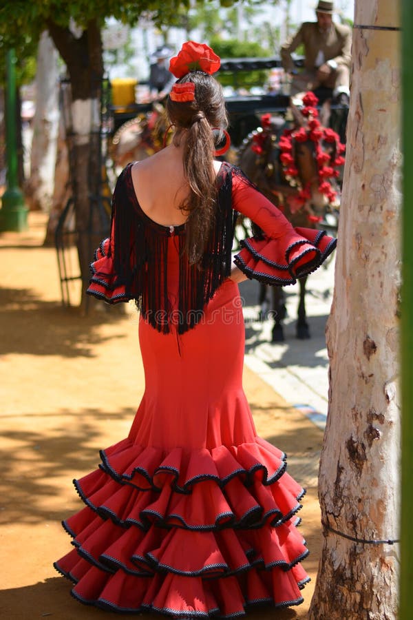 The beautiful attractive girl in the red flamenco dress