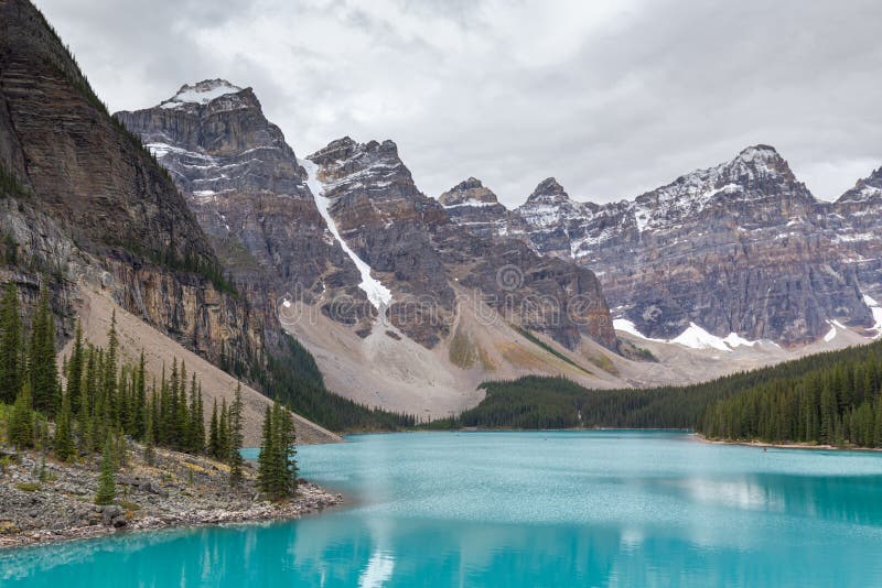 Beautiful turquoise water surround with taiga forest and rocky mountain in summer morning at Moraine Lake,Alberta Canada