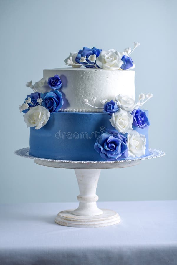Beautiful Two Tiered White and Blue Wedding Cake Decorated with Flowers Sugar Roses. Concept of Elegant Holiday Desserts Stock Image - Image of catering, rose: 113239903 Beautiful Two Tiered White And Blue Wedding Cake Decorated With Flowers Sugar Roses. Concept Of Elegant Holiday Desserts Stock Image - Image Of Catering, Rose: 113239903