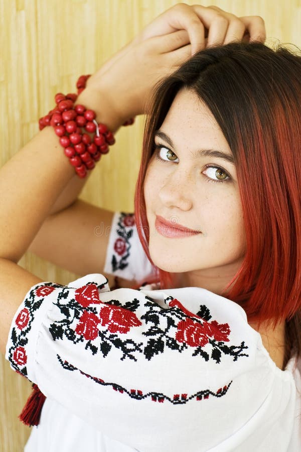 Beautiful Ukrainian Girl In Traditional Embroidered Shirt And Green