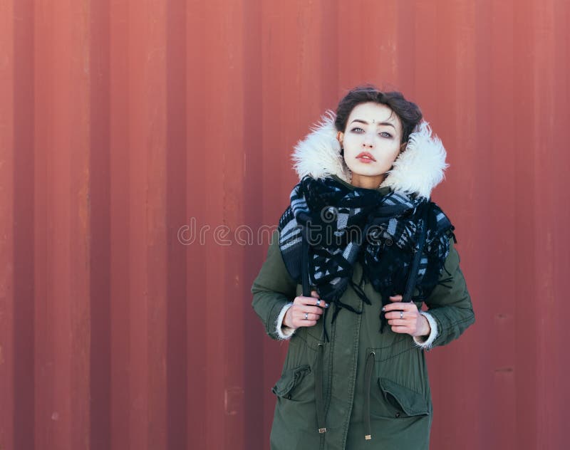 Beautiful unusual girl in green jacket stock photography