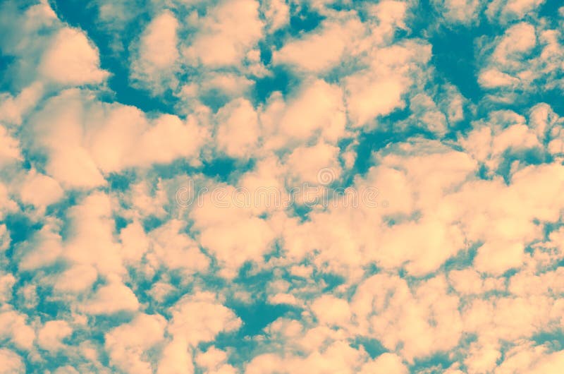 Beautiful unusual sky texture. small clouds tinted in pink color royalty free stock image