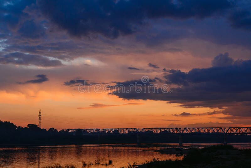 Beautiful Yellow Purple Sunset Over The River In Summer Stock Photo