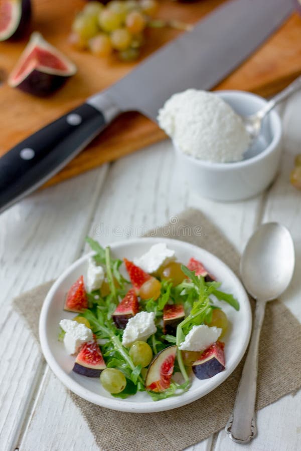 Beautiful vegetarian salad with goat cheese and figs. stock photos Beautiful vegetarian salad with goat cheese and figs. stock photos