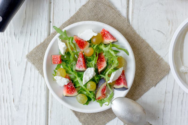 Beautiful vegetarian salad with goat cheese and figs. stock images Beautiful vegetarian salad with goat cheese and figs. stock images