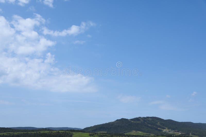 Beautiful view of forest in mountains under blue sky royalty free stock images