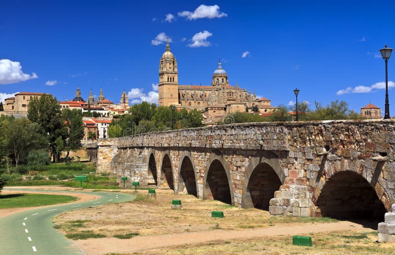 Beautiful view of the historic city of Salamanca with New Cathedral and Roman bridge, Castilla y Leon region, Spain.