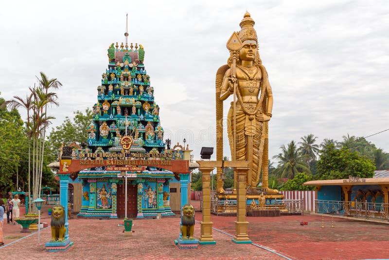 Beautiful view of a large golden Kartikeya aka Murugan, Skanda, Kumara, Subrahmanya statue at the Sri raja rajesweri amman koil Hindu temple in Sumatra, Indonesia. Beautiful view of a large golden Kartikeya aka Murugan, Skanda, Kumara, Subrahmanya statue at the Sri raja rajesweri amman koil Hindu temple in Sumatra, Indonesia