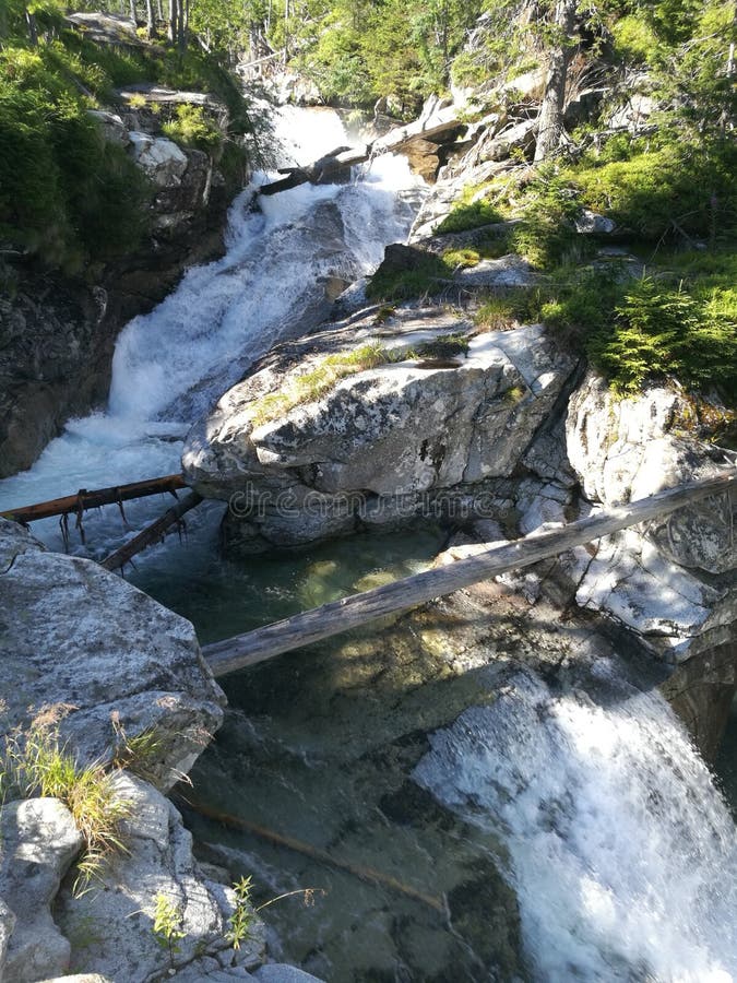 Beautiful view of nature scene in mountains with waterfall in Tatra, Slovakia