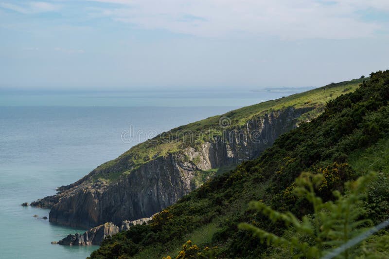 View from the cliffs of Co. Wicklow, Ireland over the Irish sea with Greystones in the distance royalty free stock image View from the cliffs of Co. Wicklow, Ireland over the Irish sea with Greystones in the distance royalty free stock image