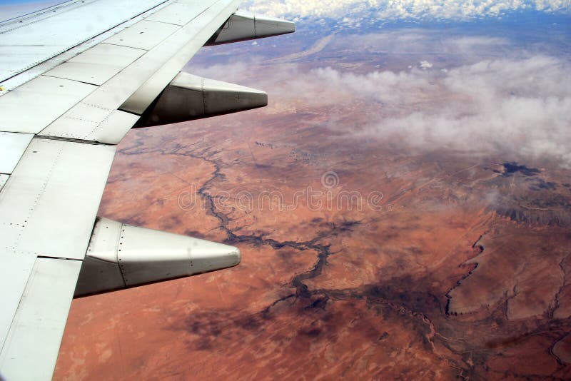 Beautiful view over the desert, seen from jet plane`s window seat