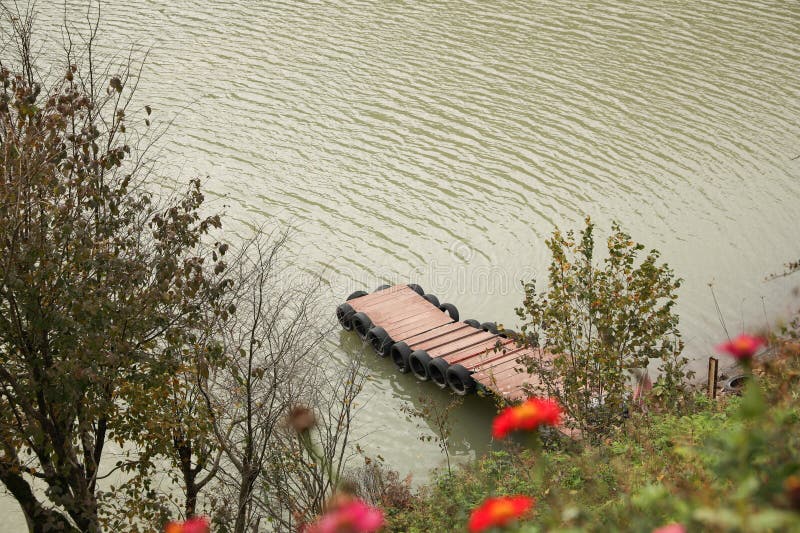 Beautiful view of river with wooden pier royalty free stock photography