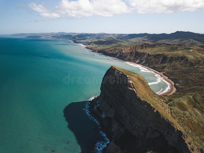 Beautiful view of turquoise water and rocky shoreline. Castlepoint, Wairarapa, New Zealand.