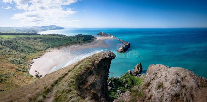 Beautiful view of turquoise water and rocky shoreline. Castlepoint, Wairarapa, New Zealand.