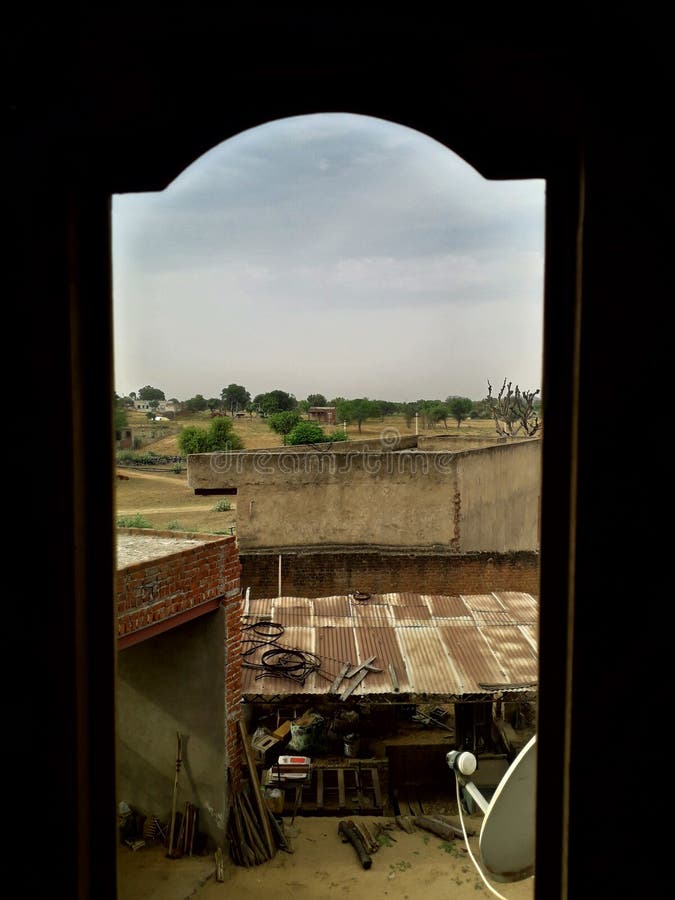 A Beautiful View of a Village Outside from a Wooden Window Stock Image