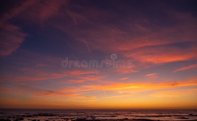 Beautiful, vivid sunset sky over ocean with red clouds and blue yellow gradient background royalty free stock images Beautiful, vivid sunset sky over ocean with red clouds and blue yellow gradient background royalty free stock images