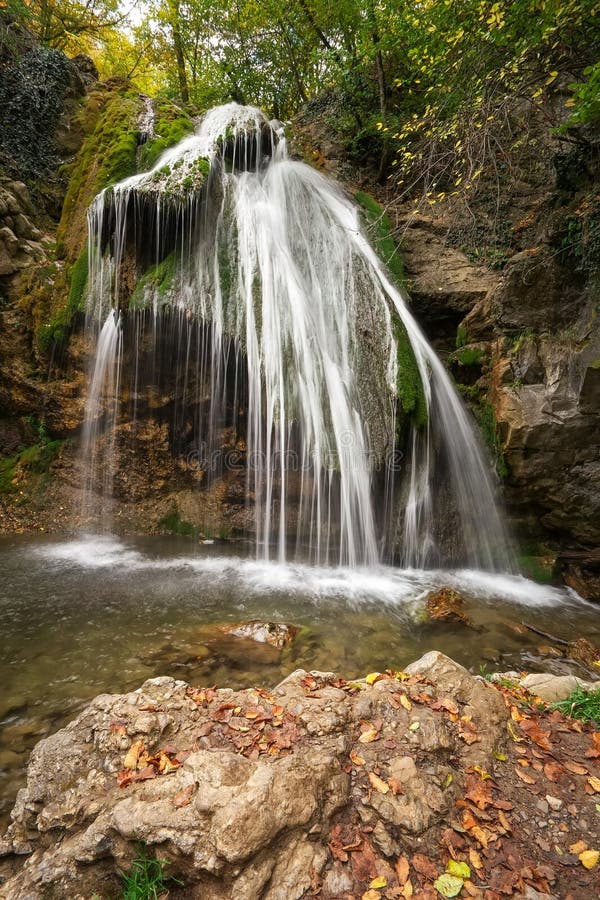 Beautiful Waterfall At Mountain River In Colorful Autumn Forest Nature