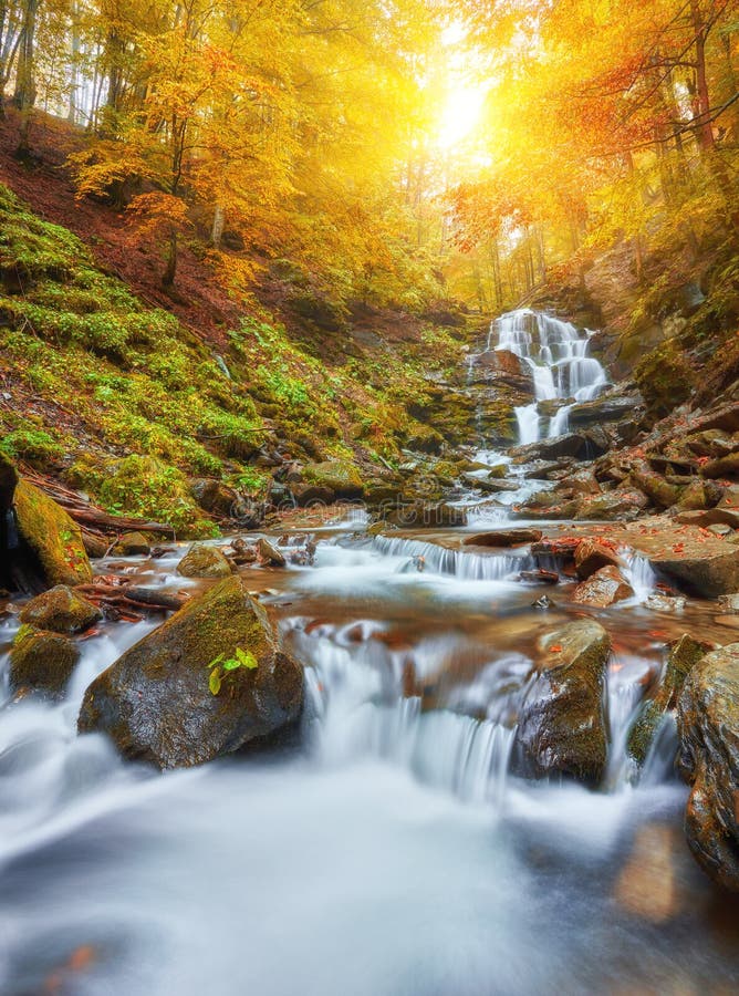 Beautiful Waterfall At Mountain River In Colorful Autumn Forest With