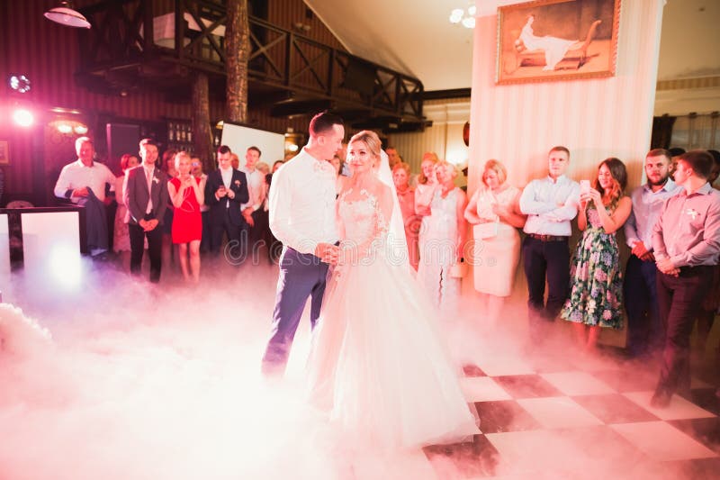 Beautiful Wedding Couple Just Married and Dancing Their First Dance