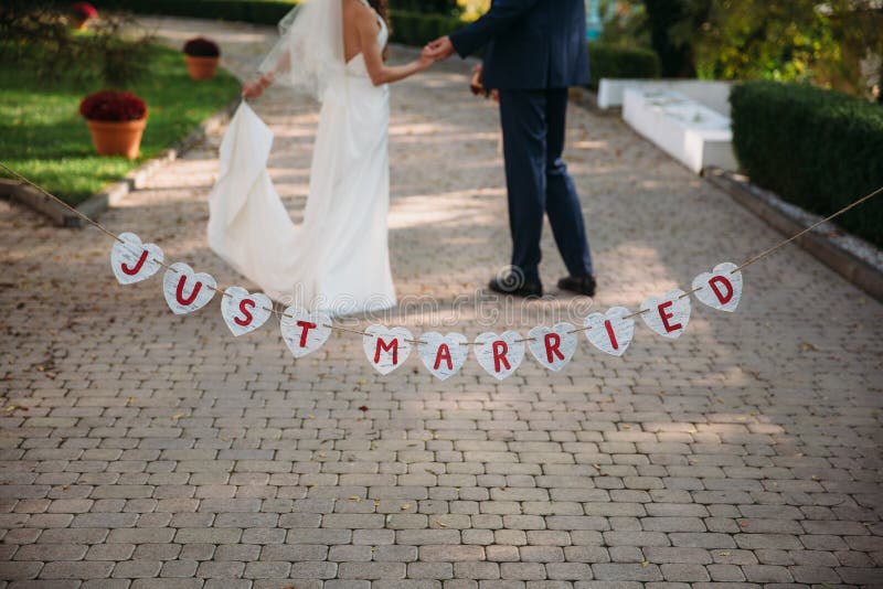 Beautiful wedding inscription just married. Close-up beauty placard. Bridal and groom accessories. Details for marriage