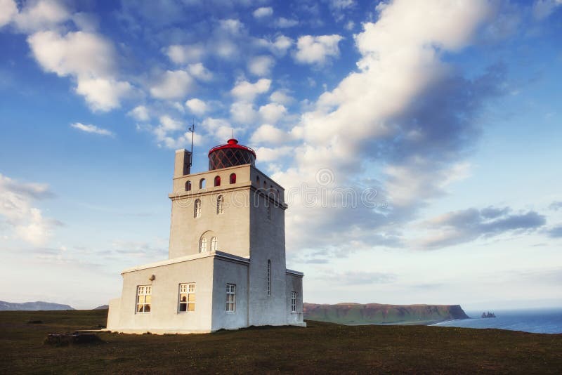 Beautiful white lighthouse at Cape Dyrholaey, South Iceland. royalty free stock images Beautiful white lighthouse at Cape Dyrholaey, South Iceland. royalty free stock images
