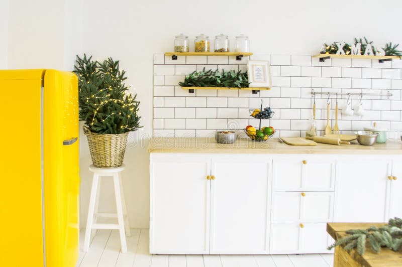 beautiful white cosy modern kitchen interior,kitchenware, home style, with bright yellow fridge , christmas decorations royalty free stock image beautiful white cosy modern kitchen interior,kitchenware, home style, with bright yellow fridge , christmas decorations royalty free stock image