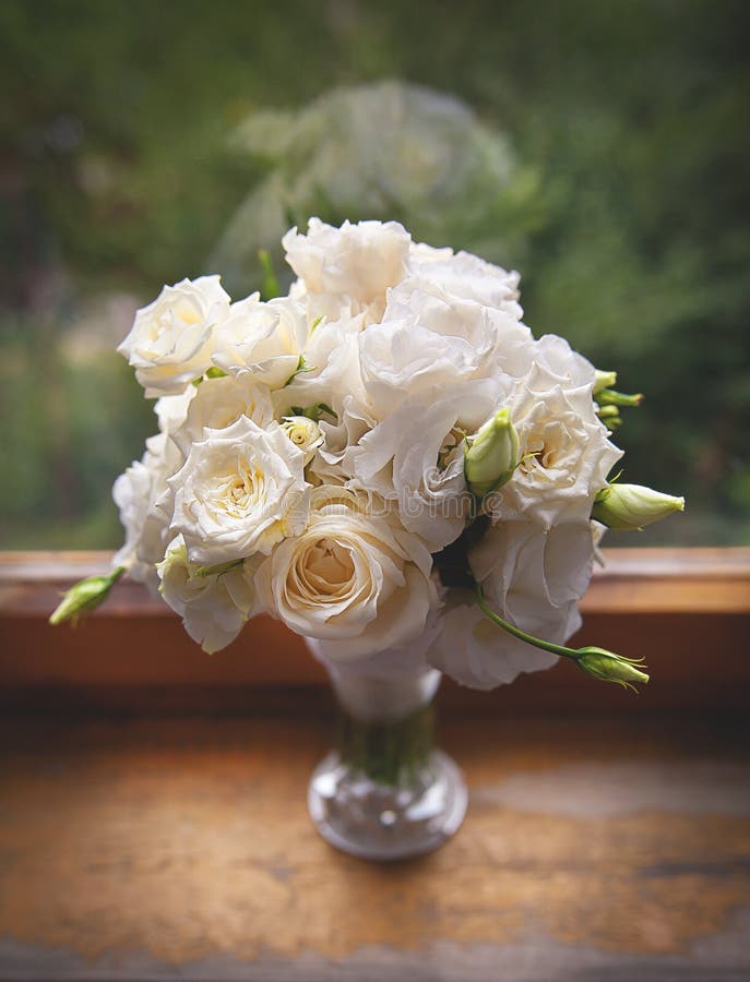 Beautiful White Roses In A Glass Vase Near Window Stock