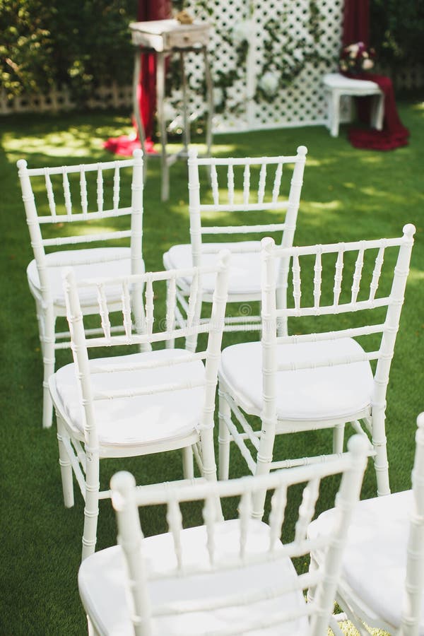 Beautiful White Wedding Chairs at the Ceremony in the Park Stock Image