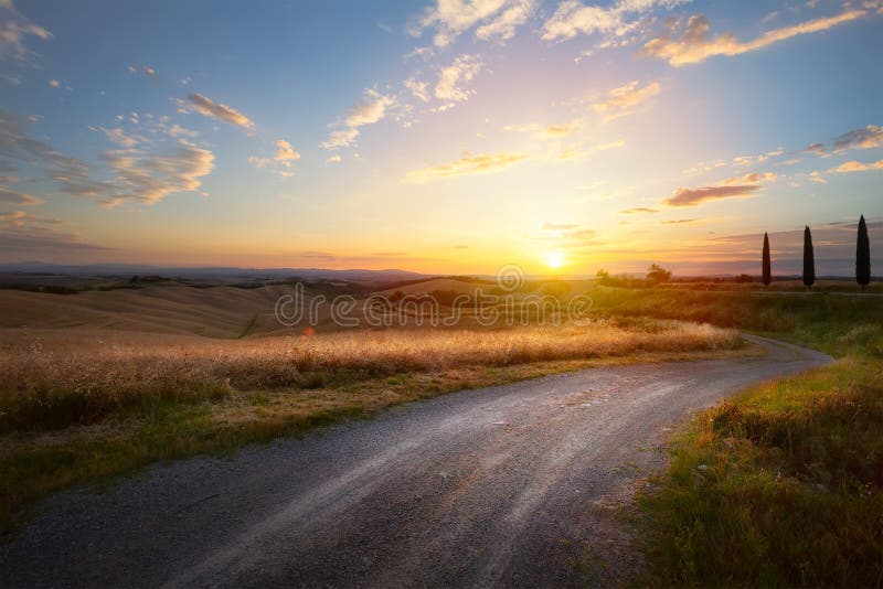 Beautiful winding country road leading through rural countryside