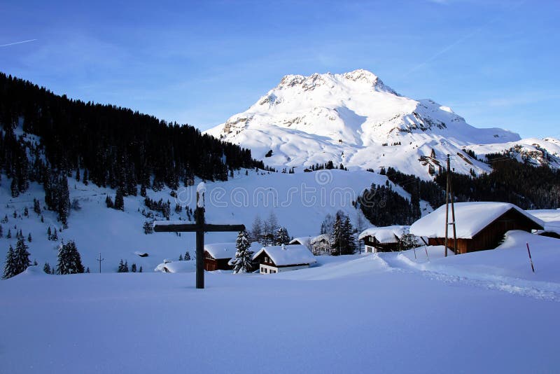 Beautiful Winter Mountain Scenery with Cross