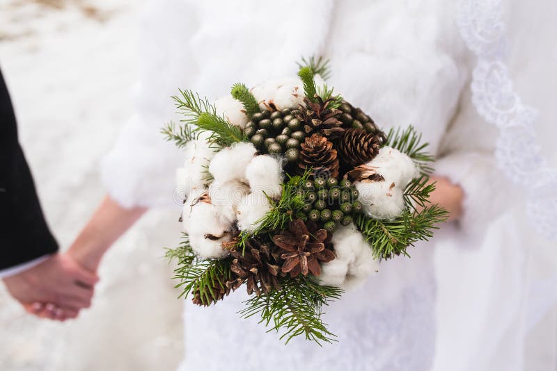 Wedding Winter Bouquet Of The Bride Bouquet Of Spruce Cones Cotton Cinnamon  Sticks Wedding Accessories Floristry Stock Photo - Download Image Now -  iStock