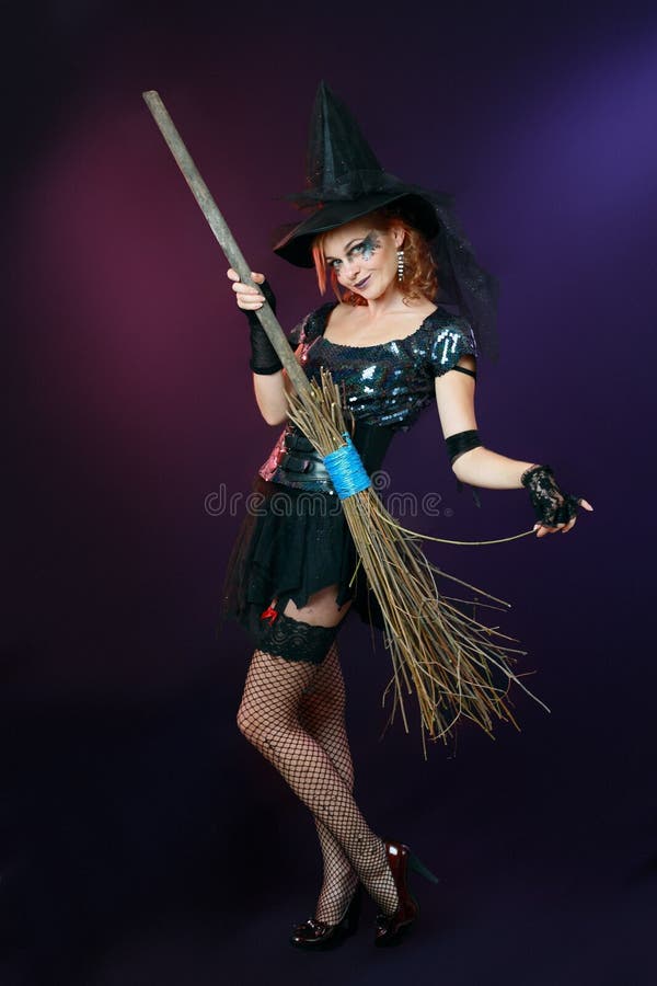 Beautiful witch hold broom stock photo. Image of costume - 27442006