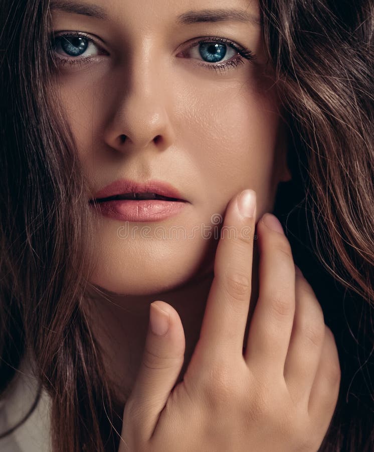 Beautiful Woman Applying Cosmetics With Her Hand On Face Natural Look