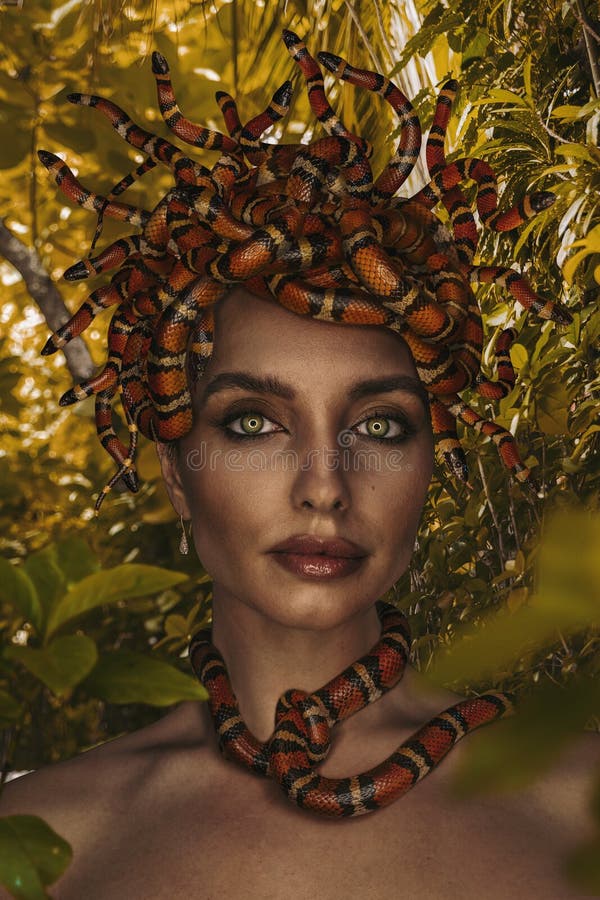 Beautiful woman as Gorgon with corn snake stock images