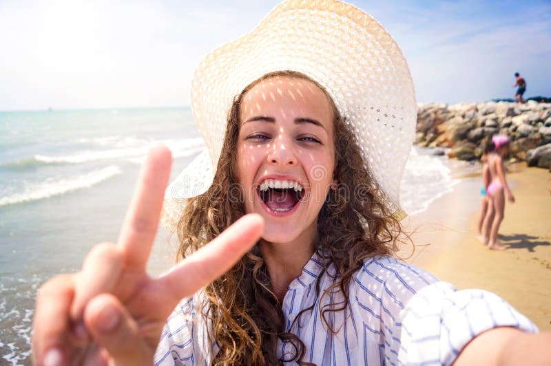 Beautiful Woman On Beach Laughing Taking Selfie Sunny Day Stock