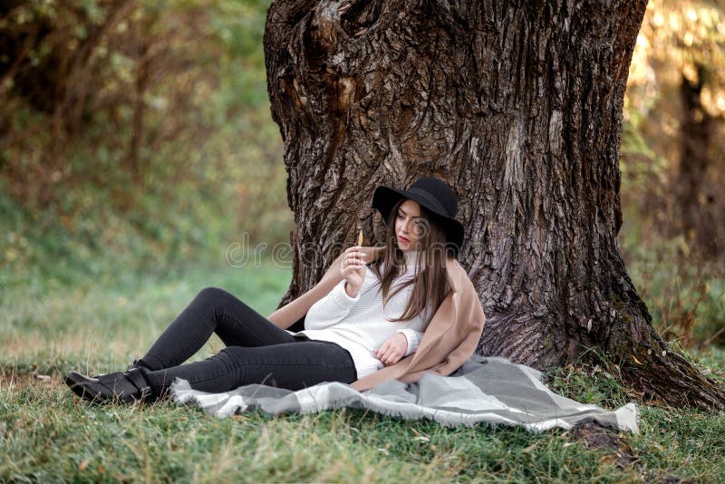 Beautiful Woman in Black Hat Sitting Under Big Tree Stock Image - Image ...