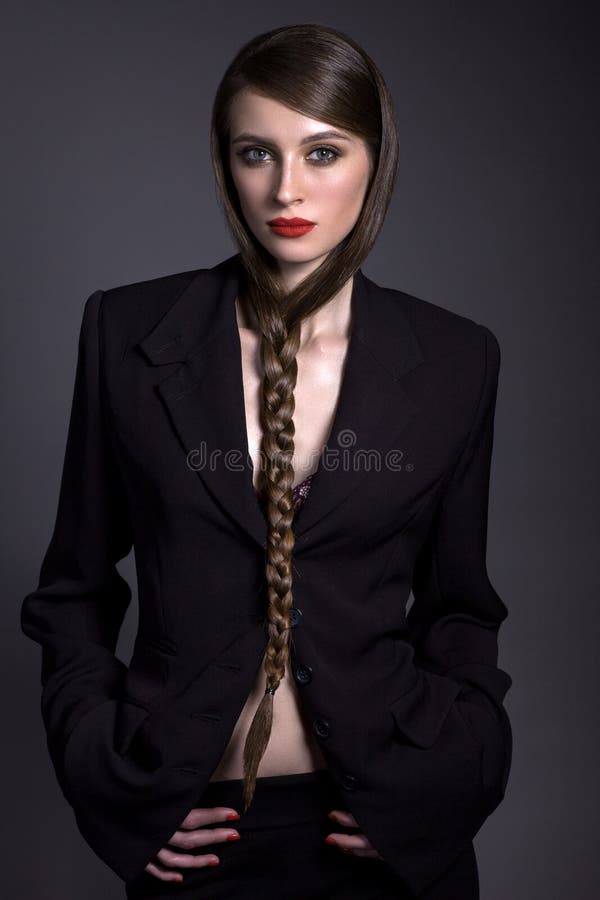 Beautiful Woman in a Black Jacket with a Creative Hairdress on a Stock  Image - Image of dark, contrast: 107624067