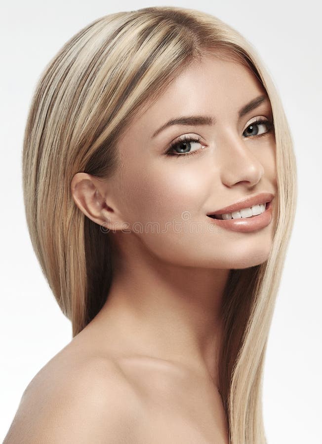 Beautiful woman blonde hair portrait close up studio on white long hair