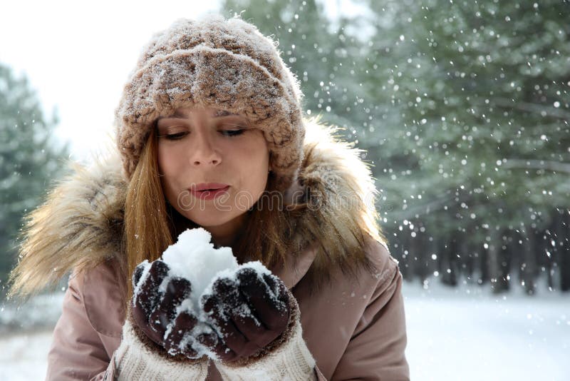 Beautiful Woman Blowing Snow in Winter Forest. Stock Photo - Image of ...