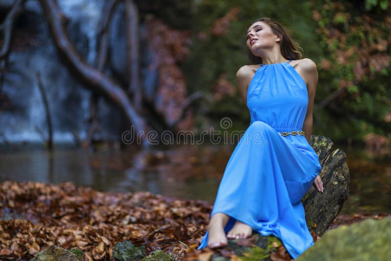 A Beautiful Woman In Blue Dress Near A Waterfall Stock Image Image Of Natural Forest 164891355