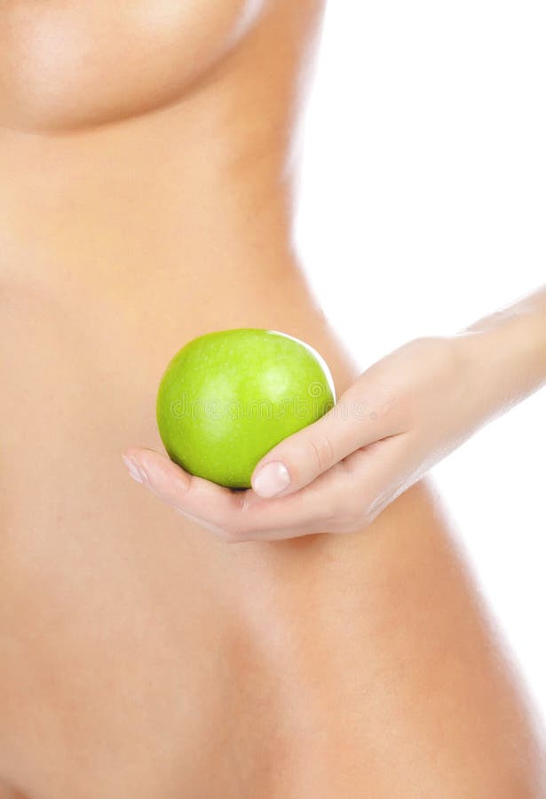 Beautiful woman body and green apple.