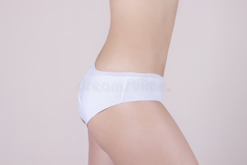 Woman In Panties Holding Her Crotch On A White Background Stock