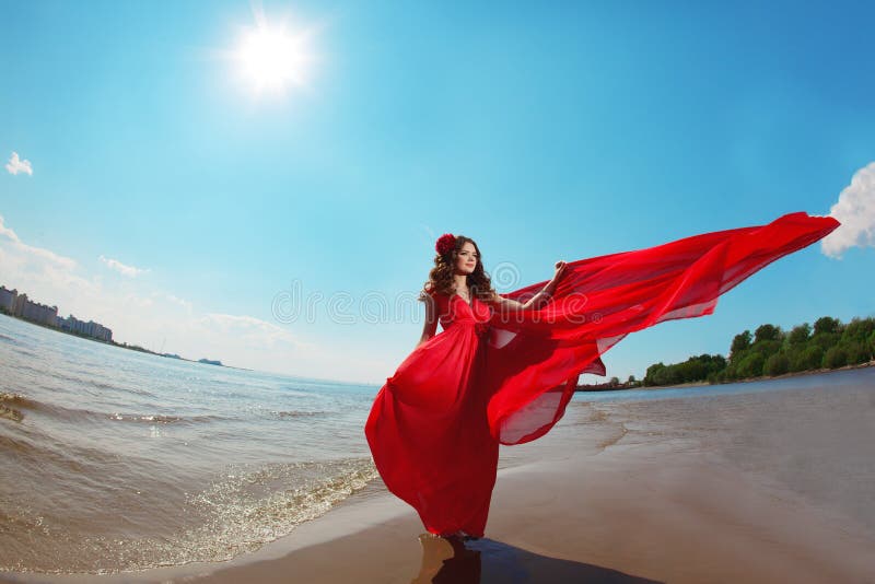 Beautiful woman in a bright red dress