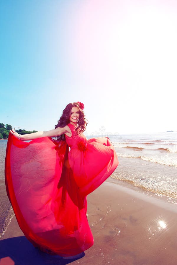 Beautiful woman in a bright red dress