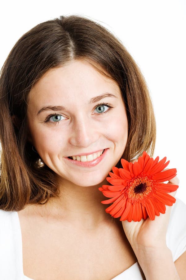 Beautiful woman with a bright red flower