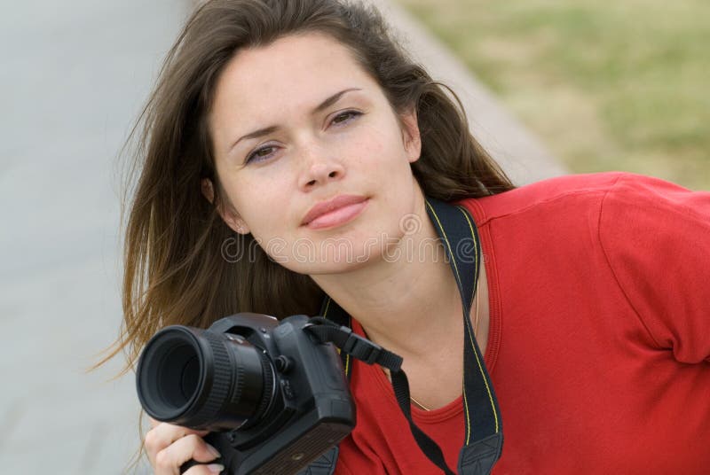 Beautiful woman with camera