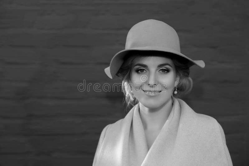 Beautiful woman in a coat hat and a white dress for a walk in an autumn park or forest. royalty free stock image Beautiful woman in a coat hat and a white dress for a walk in an autumn park or forest. royalty free stock image