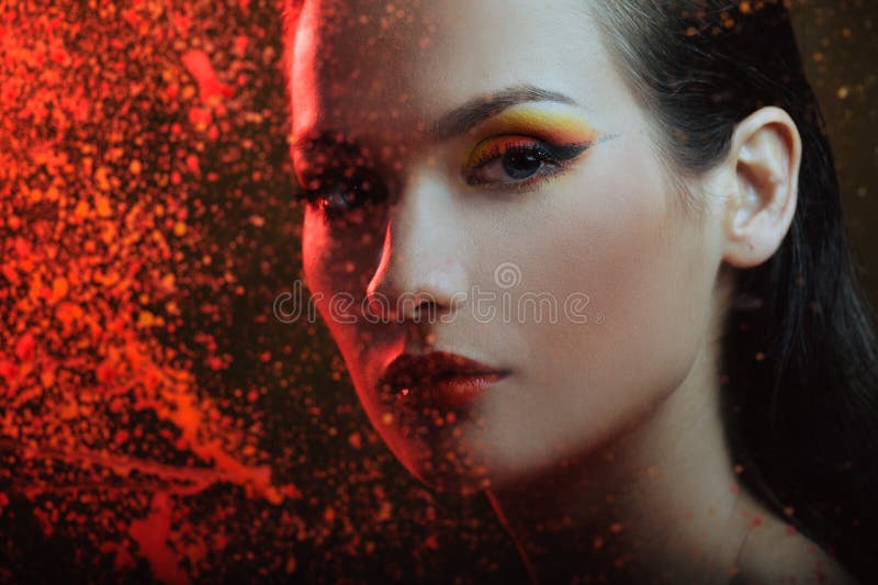 Beautiful woman in color spray