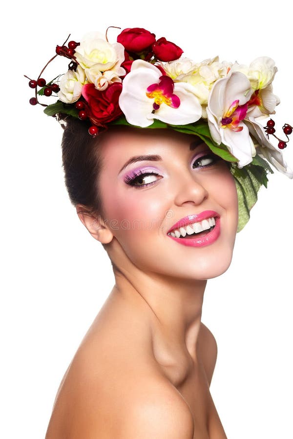 Beautiful woman with colorful flowers on head